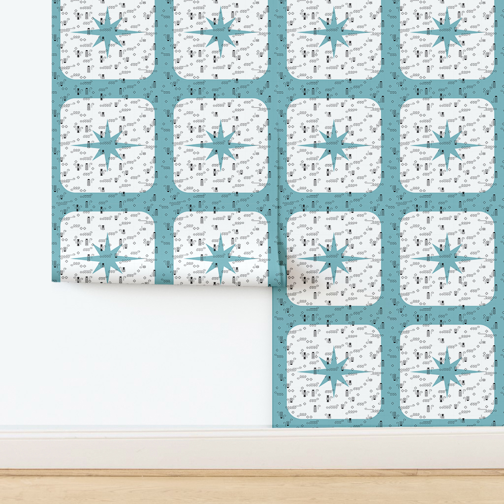 The artwork features a repeating geometric pattern of symmetrical shapes resembling elongated, curved diamonds or petals in various shades of blue and green. Each shape is split vertically with one half filled with a light blue and the other half filled with green or darker blue. The background is a light, almost pastel blue, which provides a soft yet vibrant backdrop. One of the blue shapes near the upper left contains a white starburst element, adding a focal point of brightness to the composition. The overall design conveys a modern, mid-century aesthetic with clean lines and harmonious color contrasts.